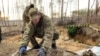 Ukraine--Oleksiy Yukov, head of the Platzdarm search unit, exhumation of fallen soldiers