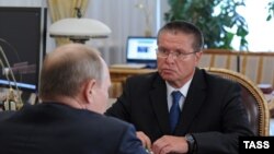 Алексей Улюкаев во время встречи с президентом России Владимиром Путиным. 2013 год