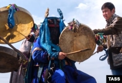 RUSSIA -- A shaman tries to summon rain on Olkhon Island, in the Irkutsk Region, August 4, 2019